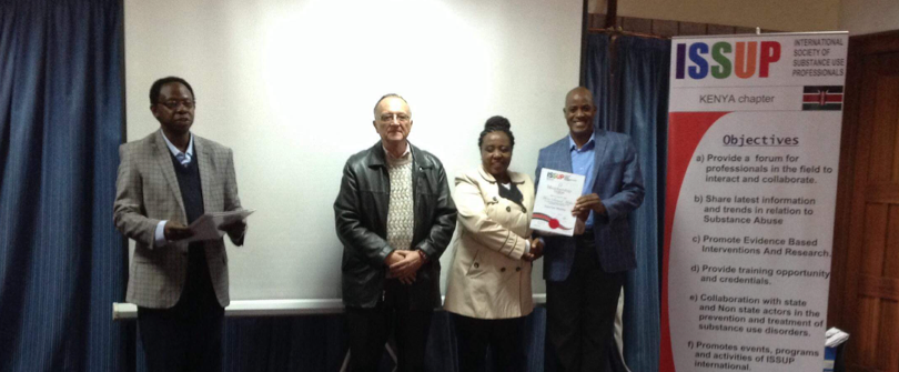 Mr. Oloo (President), Dr William Sinkele and Dr Dr. Beatrice Kathungu issuing membership certificate.