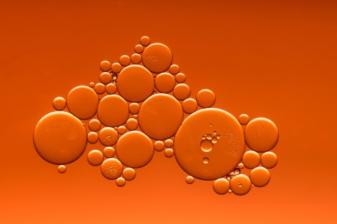 2018 European African HIV/AIDS & Hepatitis C Community Summit picture of bubbles in liquid with an rust coloured hue