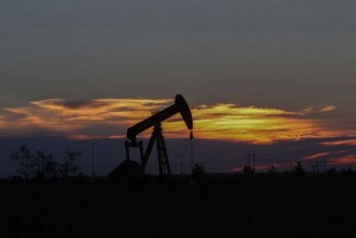 An oil rig at sunset in Midland, Texas Tuesday, June 27, 2017. Oil Rig