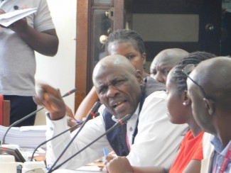 Mr.Kasirye Rogers Making a submission during the meeting